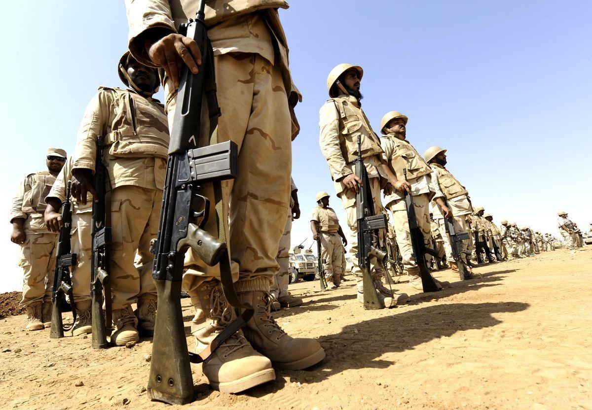 Saudi soldiers deploy near the border with Yemen in the desert region of Khuba