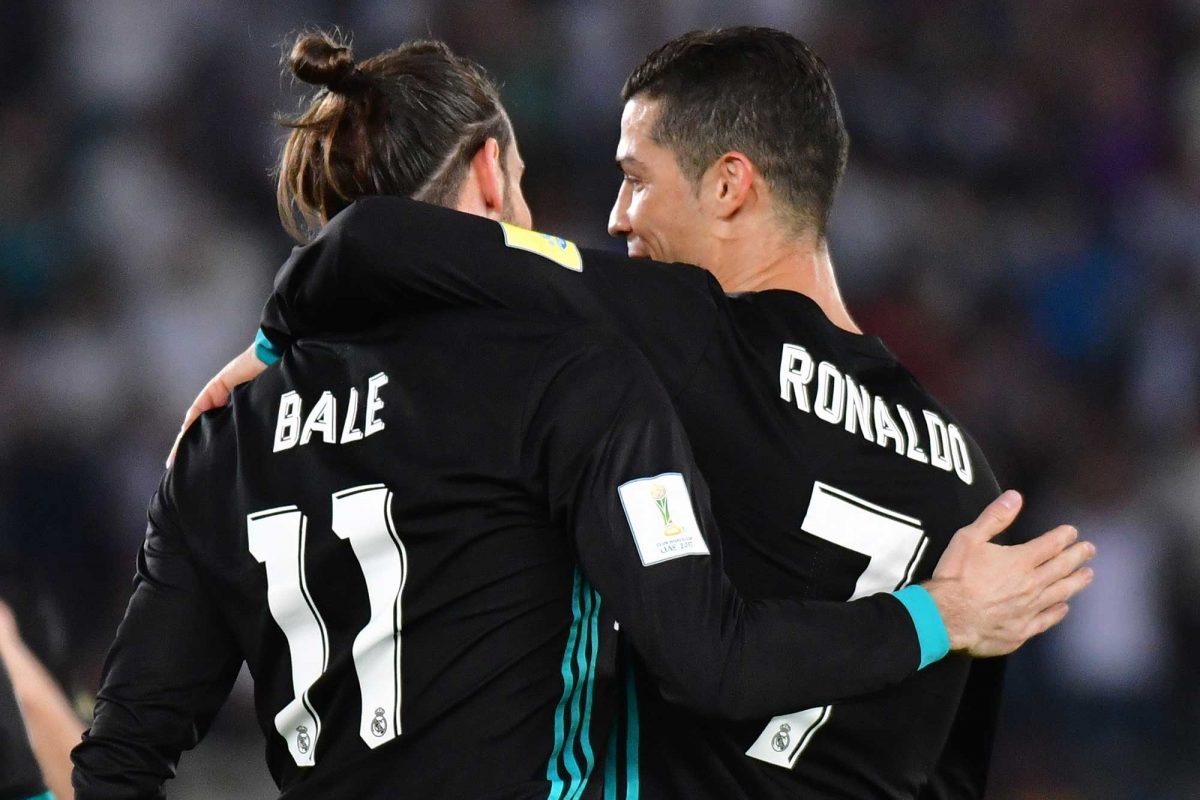 Real Madrid's Welsh forward Gareth Bale (L) is congratulated after scoring by teammate Portuguese forward Cristiano Ronaldo (R) during the FIFA Club World Cup semi-final match in Abu Dhabi.