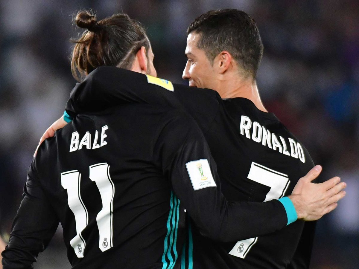 Real Madrid's Welsh forward Gareth Bale (L) is congratulated after scoring by teammate Portuguese forward Cristiano Ronaldo (R) during the FIFA Club World Cup semi-final match in Abu Dhabi.