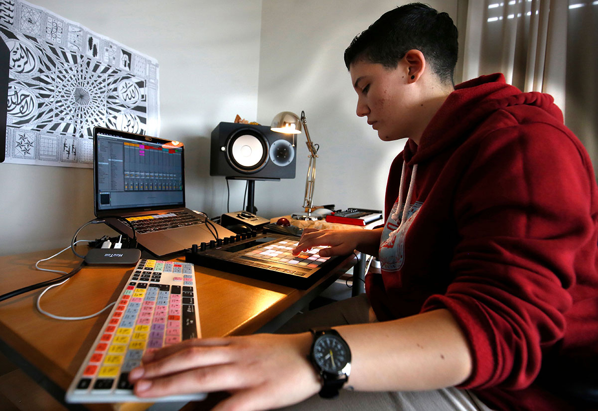 Sarouna, a Palestinian DJ, works on a music track at her home in the West Bank city of Ramallah, in the Israeli-occupied West Bank.