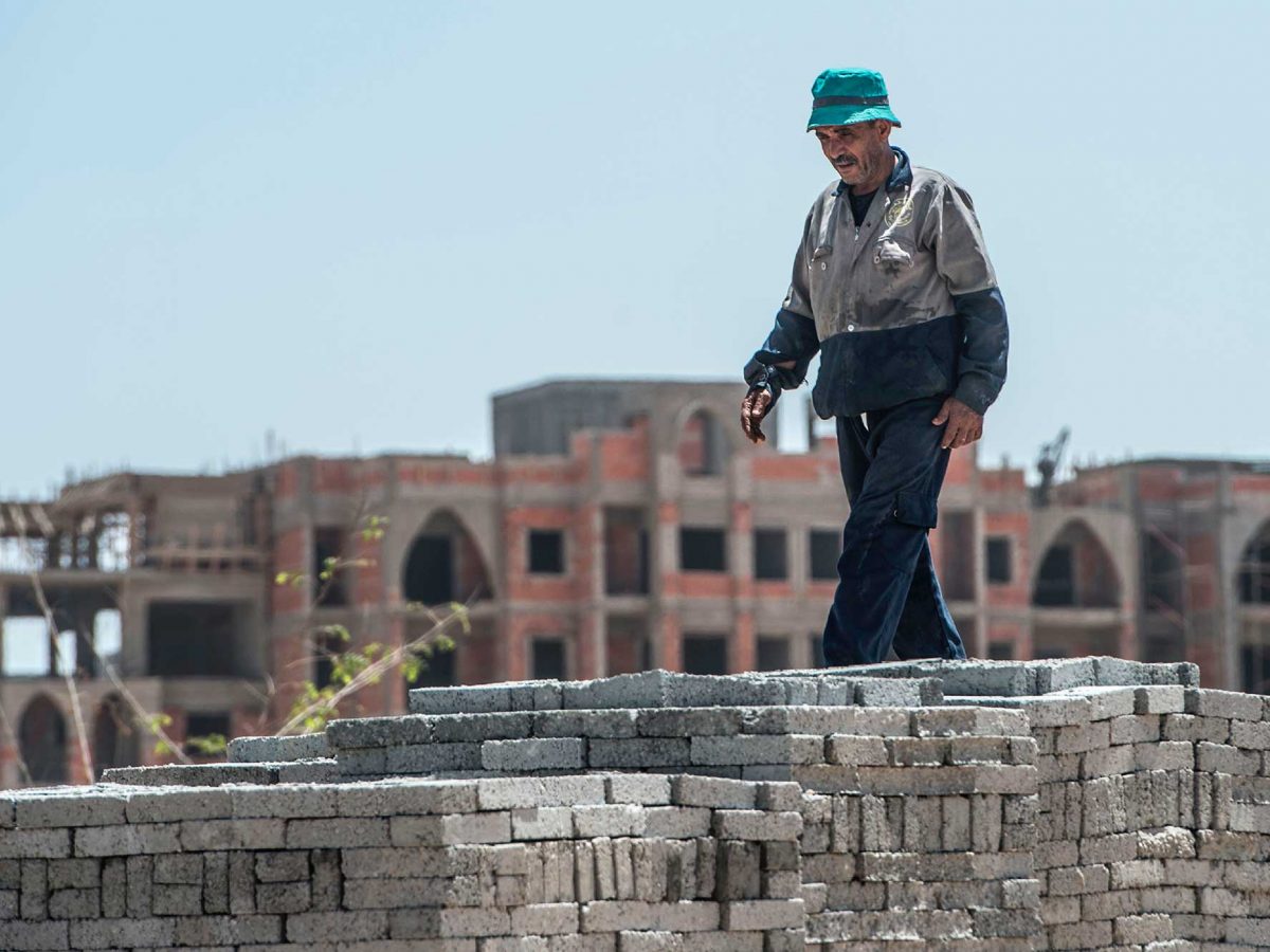 Labourers work at the construction site of the new Egyptian administrative capital, some 40 kms east of Cairo.