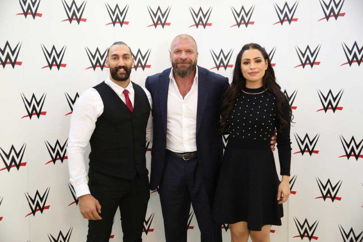 Kuwaiti figther Nasser Alruwayeh, Paul “Triple H” Levesque, WWE executive vice president, and Shadia Bseiso, the first woman from the Middle East to be signed by WWE.