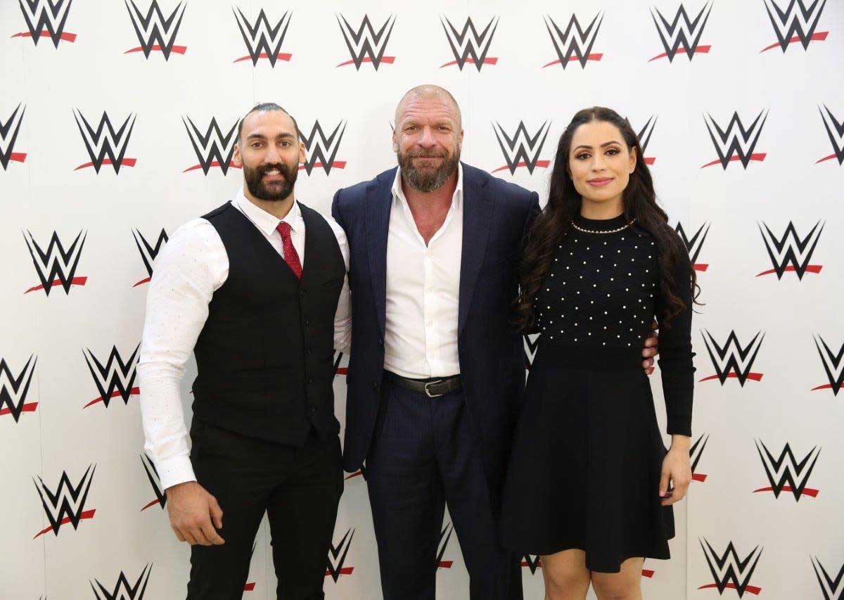 Kuwaiti figther Nasser Alruwayeh, Paul “Triple H” Levesque, WWE executive vice president, and Shadia Bseiso, the first woman from the Middle East to be signed by WWE.