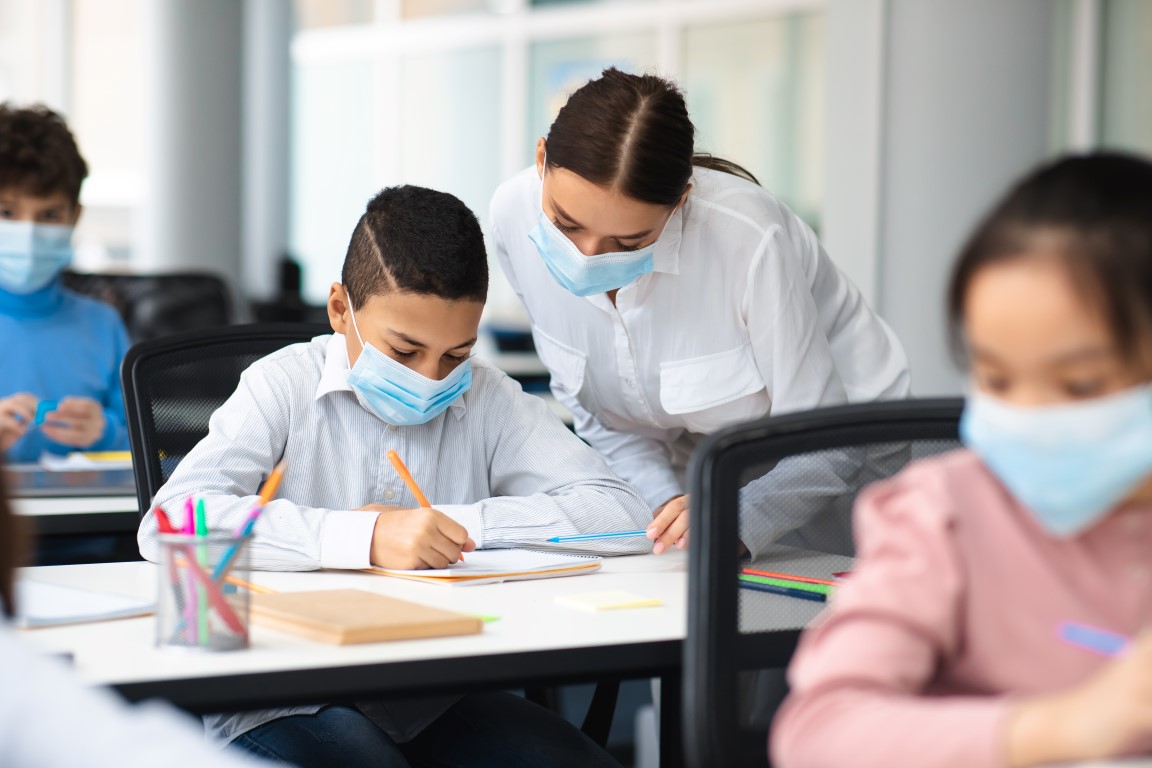 Students older than six years, staff and visitors to schools must continue to wear face masks. Image: Shutterstock