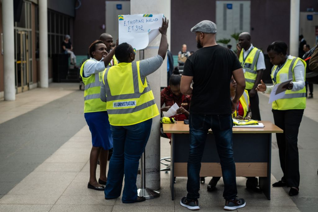 Airport staff install a help desk for the crashed Ethiopia airlines flight at the inernational arrival of the Jomo Kenyatta International Airport in Nairobi Kenya. Photo: YASUYOSHI CHIBAAFPGetty Images