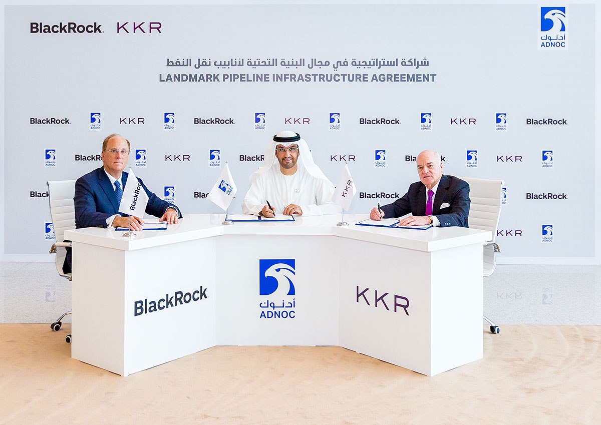 Dr Sultan Al Jaber, UAE Minister of State and ADNOC Group CEO (centre) pictured with Laurence D. Fink, chairman and CEO of BlackRock; and Henry Kravis, co-chairman and co-CEO of KKR.