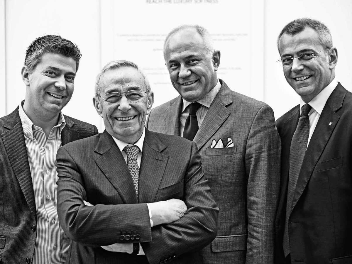 Francesco, Mario and Stefano Moreschi (back row left to right) with their father and president of the company, GianBeppe.