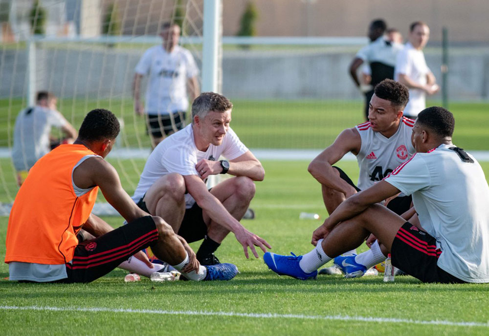 Manchester United interim manager Ole Gunnar Solskjaer pictured with players during their recent warm weather training in Dubai.