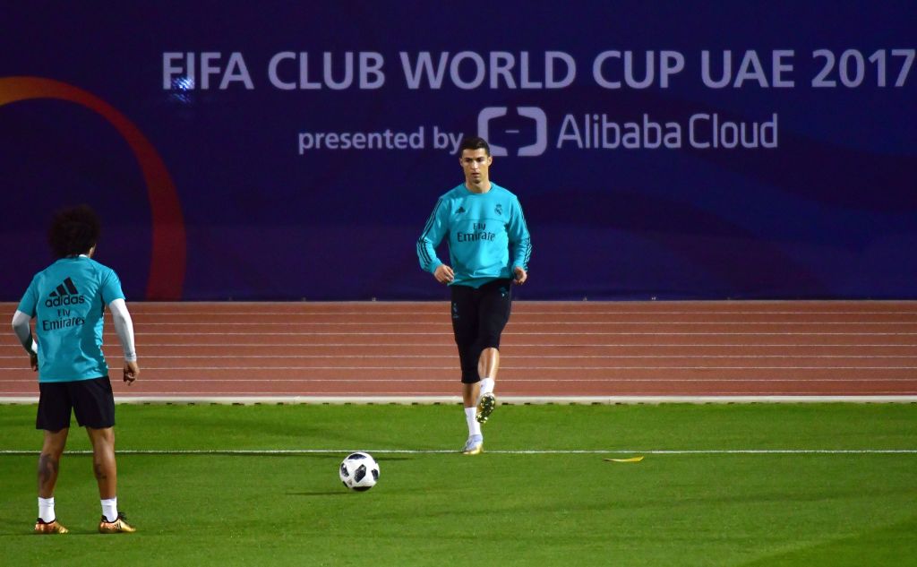 Real Madrids Portuguese forward Cristiano Ronaldo exercises on the pitch during a training session two days prior to his teams FIFA Club World Cup semifinal match at New York University Abu Dhabis stadium in the Emirati capital on December 11 2017  AFP PHOTO  GIUSEPPE CACACE        Photo credit should read GIUSEPPE CACACEAFPGetty Images