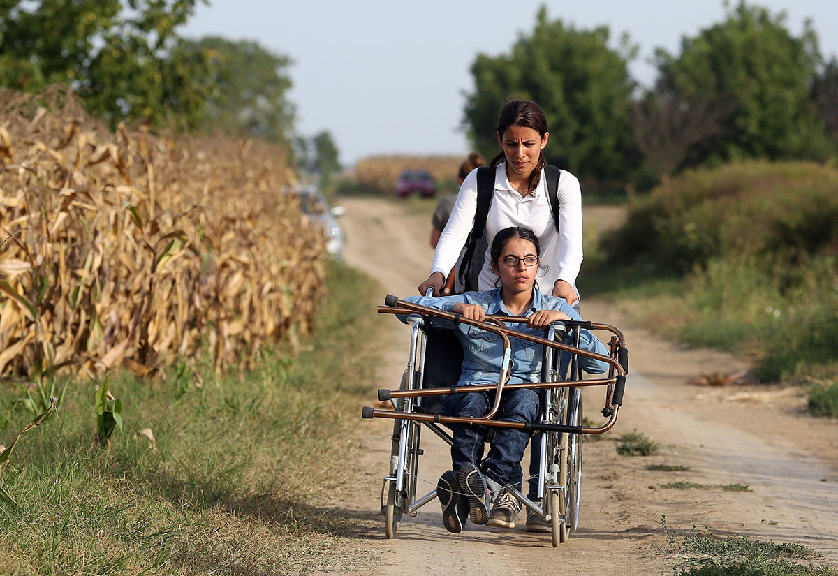 Nujeen Mustafa, refugee from Syria in a wheelchair moves towards the Croatian village of Tovarnik, close to the official Serbia-Croatia border on September 16, 2015.