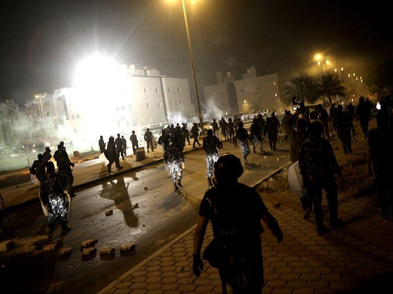 Kuwaiti riot police fire tear gas and stun grenades on April 17, 2013 at thousands of opposition activists, who were protesting against authorities for raiding the house of a key opposition leader, near Kuwait City. (AFP/Getty Images)