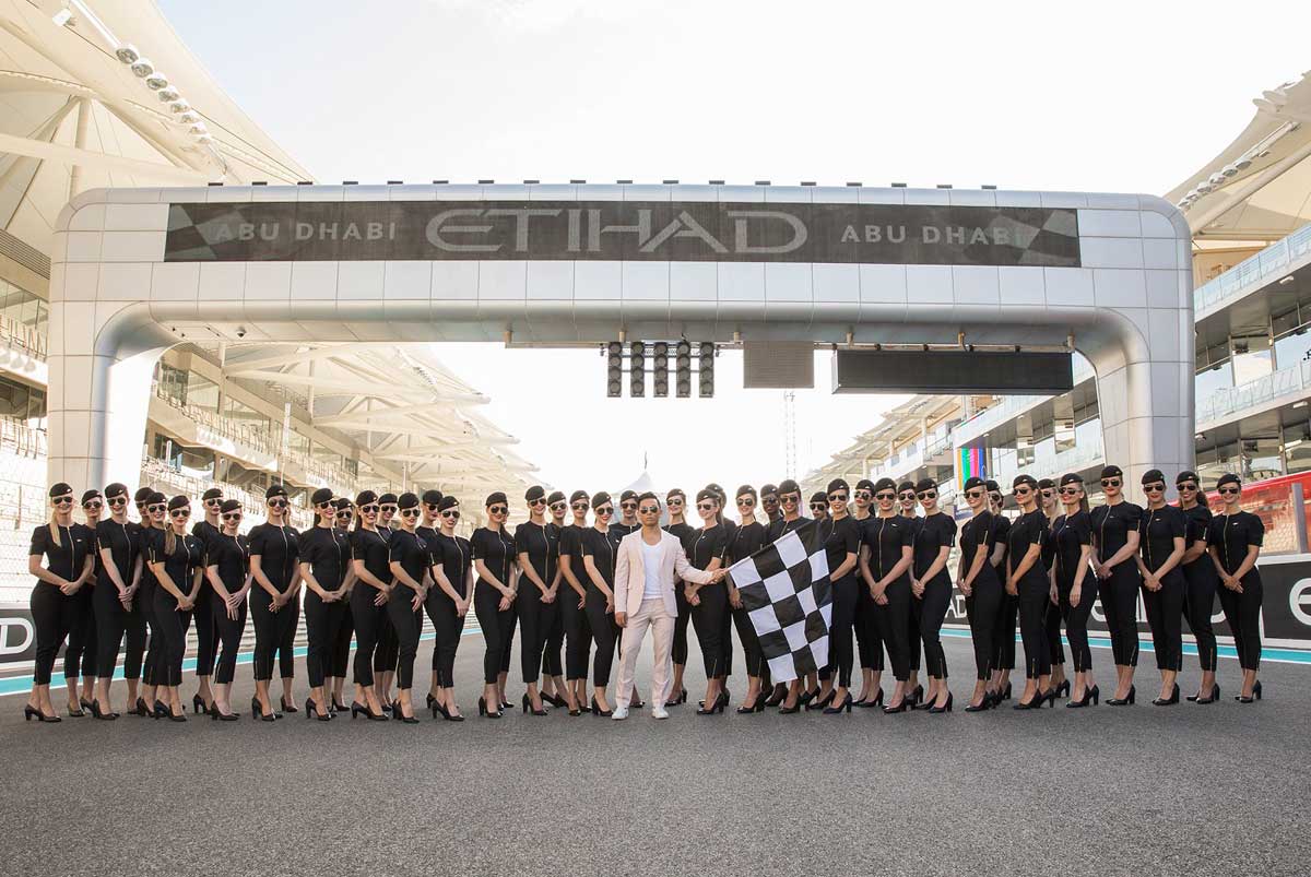 Etihad Airways revealed its new F1 Grid Girls uniform, created by renowned New York-based Nepalese designer Prabal Gurung (centre), at the 2017 Formula 1 Abu Dhabi Grand Prix.