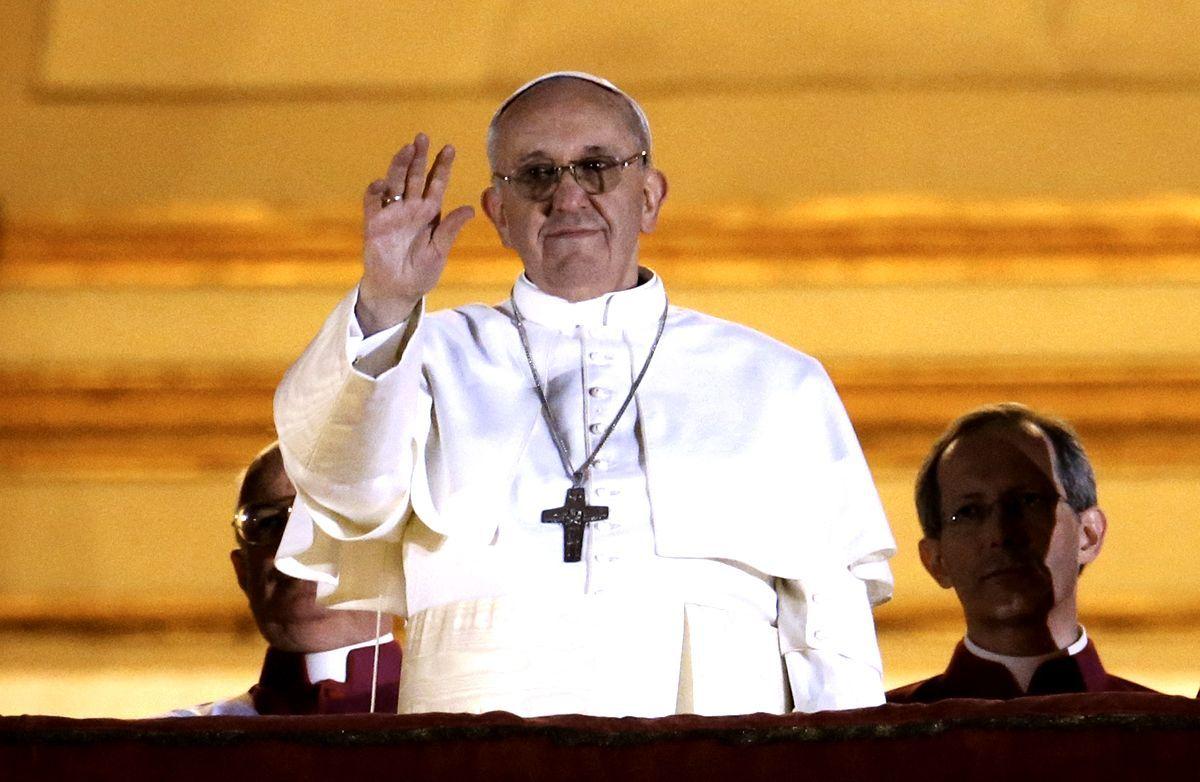 Pope Francis I waves to the waiting crowd from the central balcony of St Peter's Basilica in Vatican City. (Peter Macdiarmid/Getty Images)