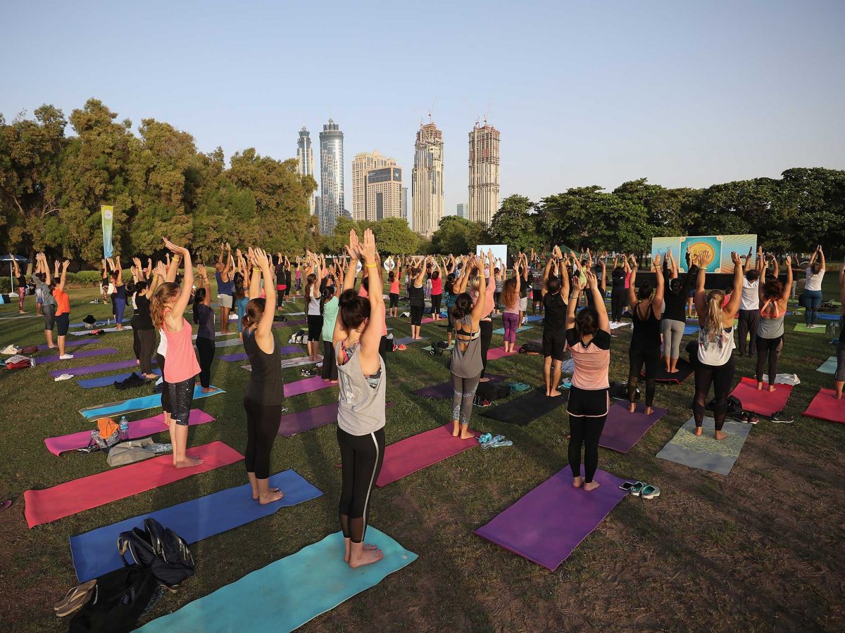 People practise Mass Mala Yoga during the Dubai Fitness Challenge Opening Carnival at Safa Park in 2017. (Getty Images)