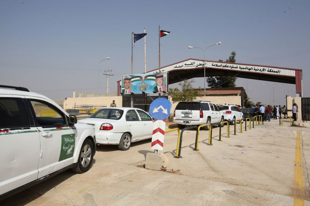 Vehicles arrive at the Jaber border crossing between Jordan and Syria Nassib crossing on the Syrian side on the day of its reopening on October 15 2018 in the Jordanian Mafraq governorate  
 Photo credit: KHALIL MAZRAAWI/AFP/Getty Images.