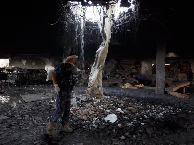 A Yemeni inspects the rubble of a destroyed funeral hall building following reported airstrikes by Saudi-led coalition air-planes on the capital Sanaa on October 8, 2016. (Mohammed Huwais/AFP/Getty Images)