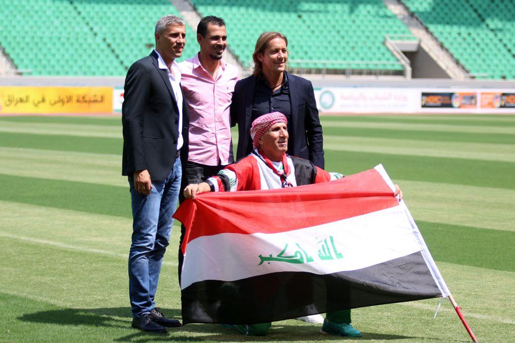 Hernan Crespo retired Argentine footballer Younis Mahmoud retired Iraqi footballer and Michel Salgado retired Spanish footballer pose for a picture with the Iraqi flag at the stadium in Basra ahead of a match between International footballers and Iraqi footballers   Photo: HAIDAR MOHAMMED ALIAFPGetty Images