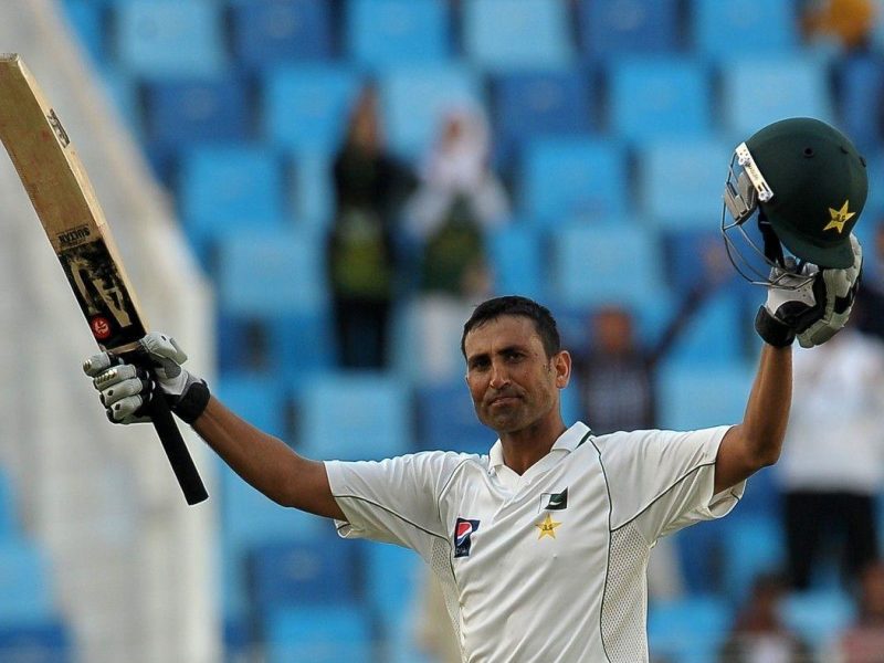 Pakistans cricketer Younis Khan raises his bat and helmet to celebrate scoring a century during the second day of the third and final Test match between Pakistan and England at the Dubai International Cricket Stadium at Dubai Sports City. (Getty Images)