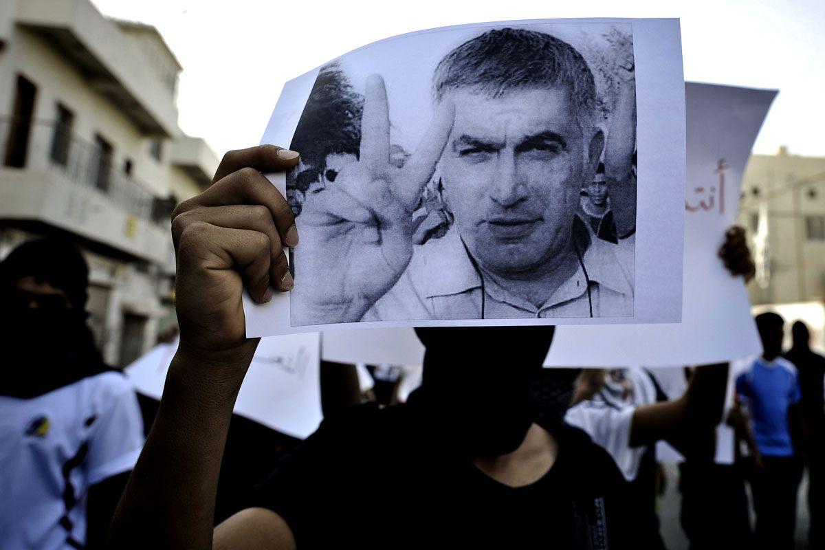 A Bahraini Shiite Muslim youth holds a picture of prominent rights activist Nabeel Rajab during a demonstration. (Getty Images)