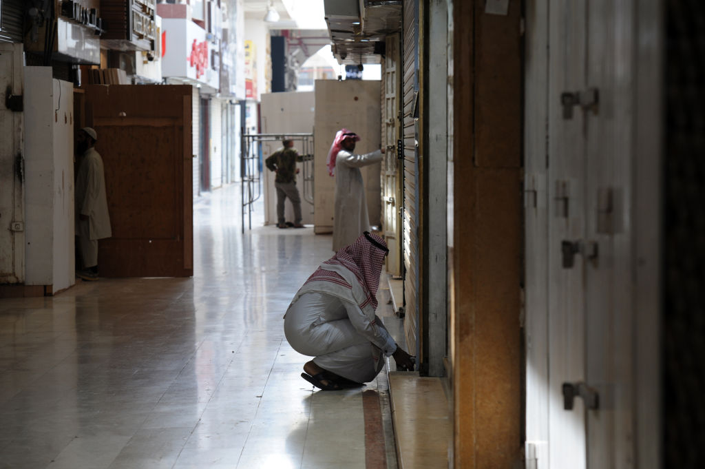 A Saudi jeweller arrives to open his shop in the Tiba gold market in the capital Riyadh. In August, the General Authority for Zakat and Tax (GAZT) discovered 323 VAT-related violations in the retail industry alone. 
Photo: FAYEZ NURELDINEAFPGetty Images