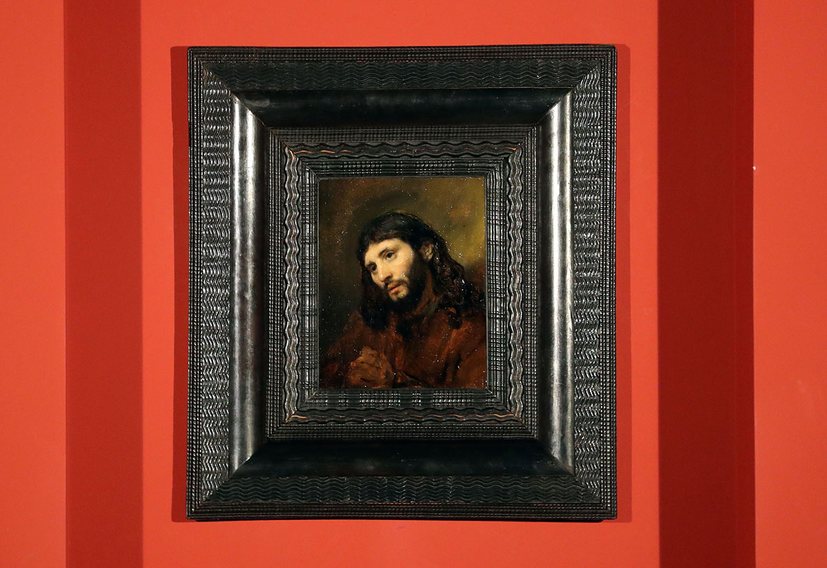 Paining entitled 'Study of the head and clasped hands of a young man as Christ in prayer', oil on oak panel, by Dutch painter Rembrandt on display at the Louvre Abu Dhabi.