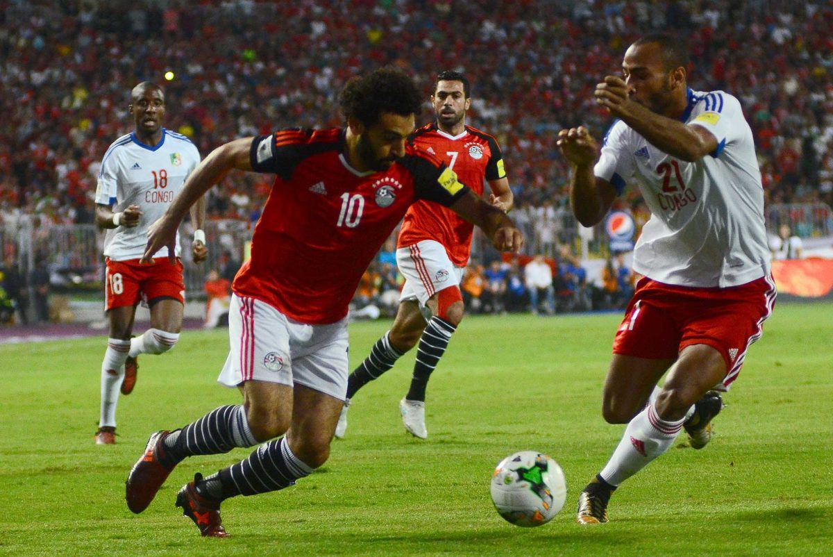 Egypt's Mohamed Salah vies for the ball against Congo's Tobias Badila during their World Cup 2018 Africa qualifying match between Egypt and Congo at the Borg el-Arab stadium in Alexandria on October 8, 2017.