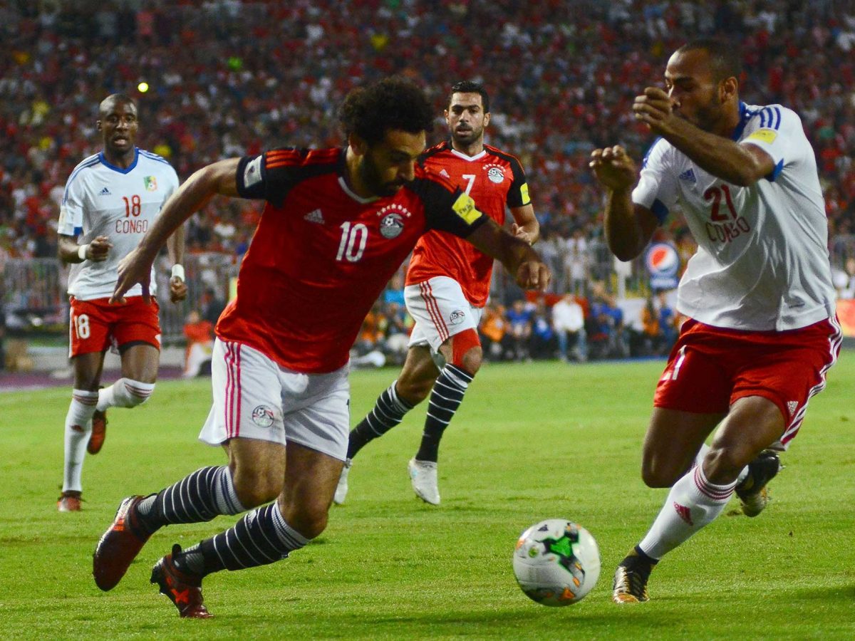 Egypt's Mohamed Salah vies for the ball against Congo's Tobias Badila during their World Cup 2018 Africa qualifying match between Egypt and Congo at the Borg el-Arab stadium in Alexandria on October 8, 2017.