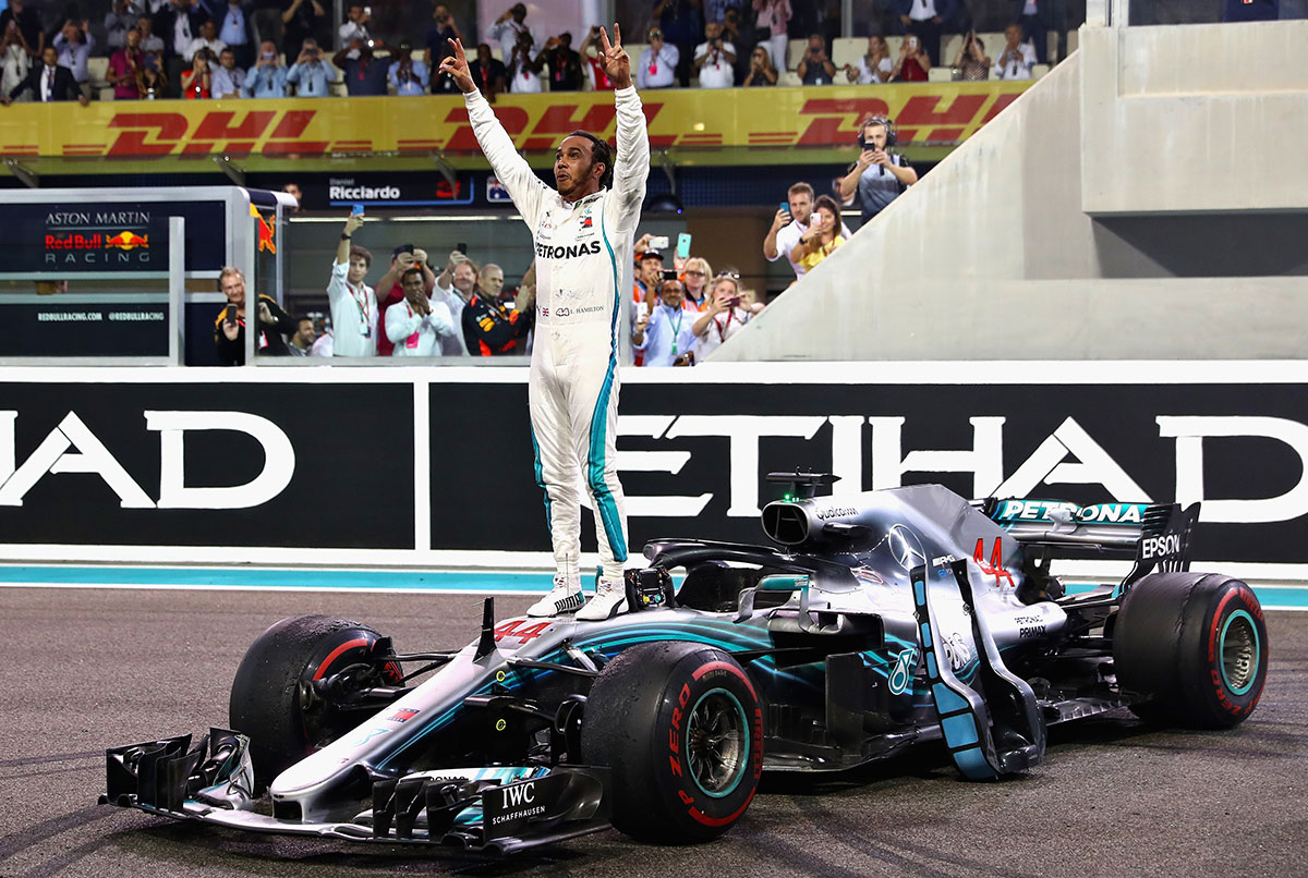 Race winner Lewis Hamilton  celebrates on track during the Abu Dhabi Formula One Grand Prix at Yas Marina Circuit on November 25, 2018. (Photo by Lars Baron/Getty Images)