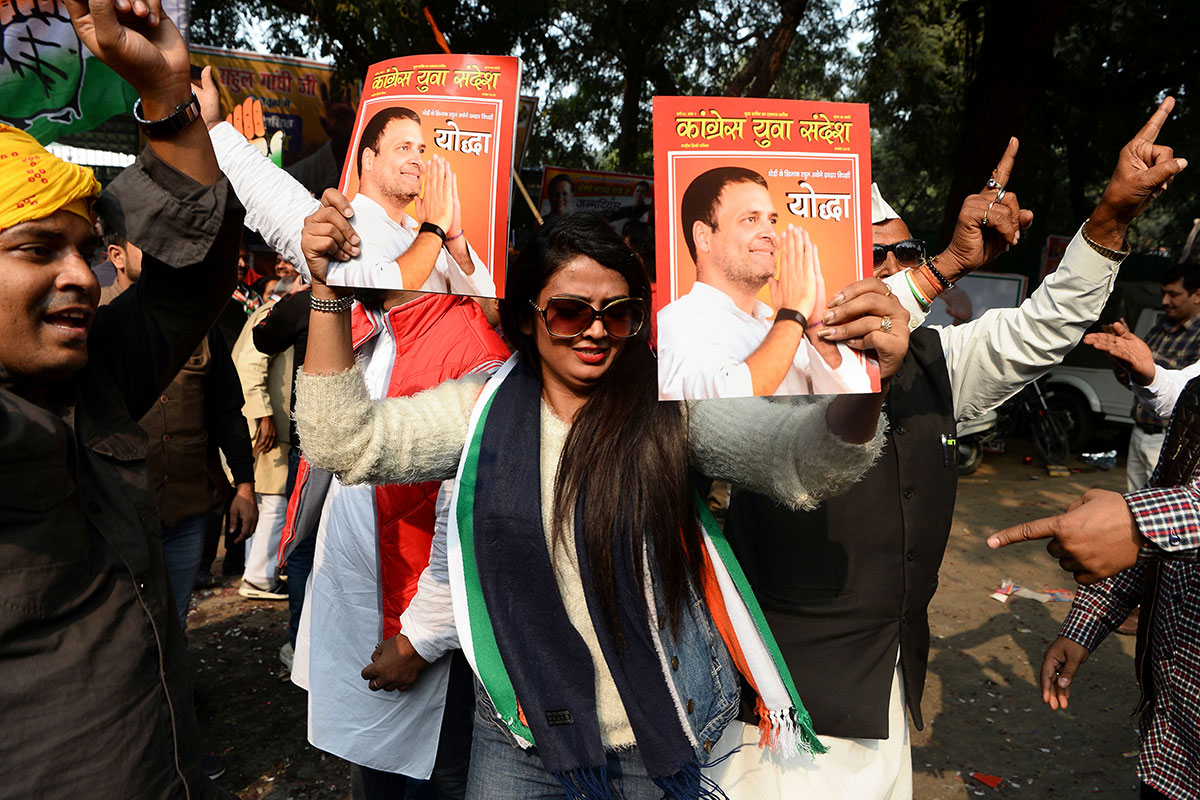 India's Congress party supporters celebrate outside the party headquarters in New Delhi on December 11, 2018, as vote counting in five Indian states began. (SAJJAD HUSSAIN/AFP/Getty Images)