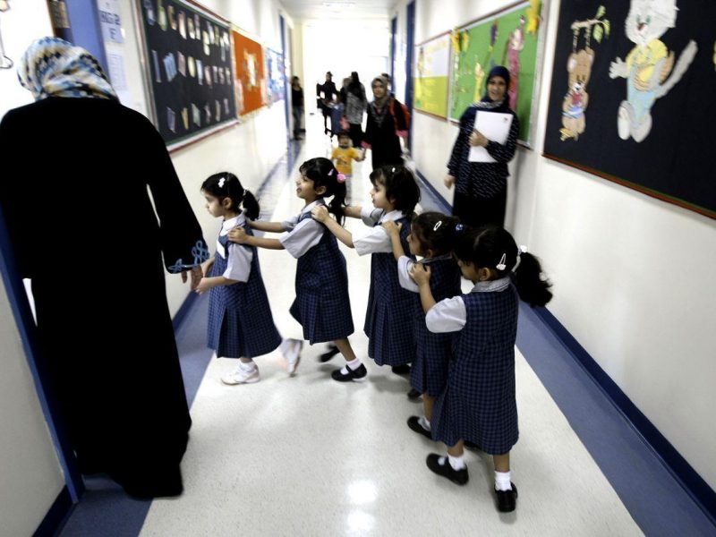 Students line-up as they ente their classroom on the first day of the academic year for public schools in Dubai on September 27, 2009. Many students were still absent as parents remain reluctant to send their children to school from fear of swine flu. (Karim Sahib/AFP/Getty Images)