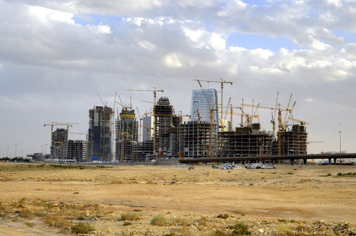 Cranes stand beside new high rise buildings under construction in the King Abdullah financial district of Riyadh. (Bloomberg)