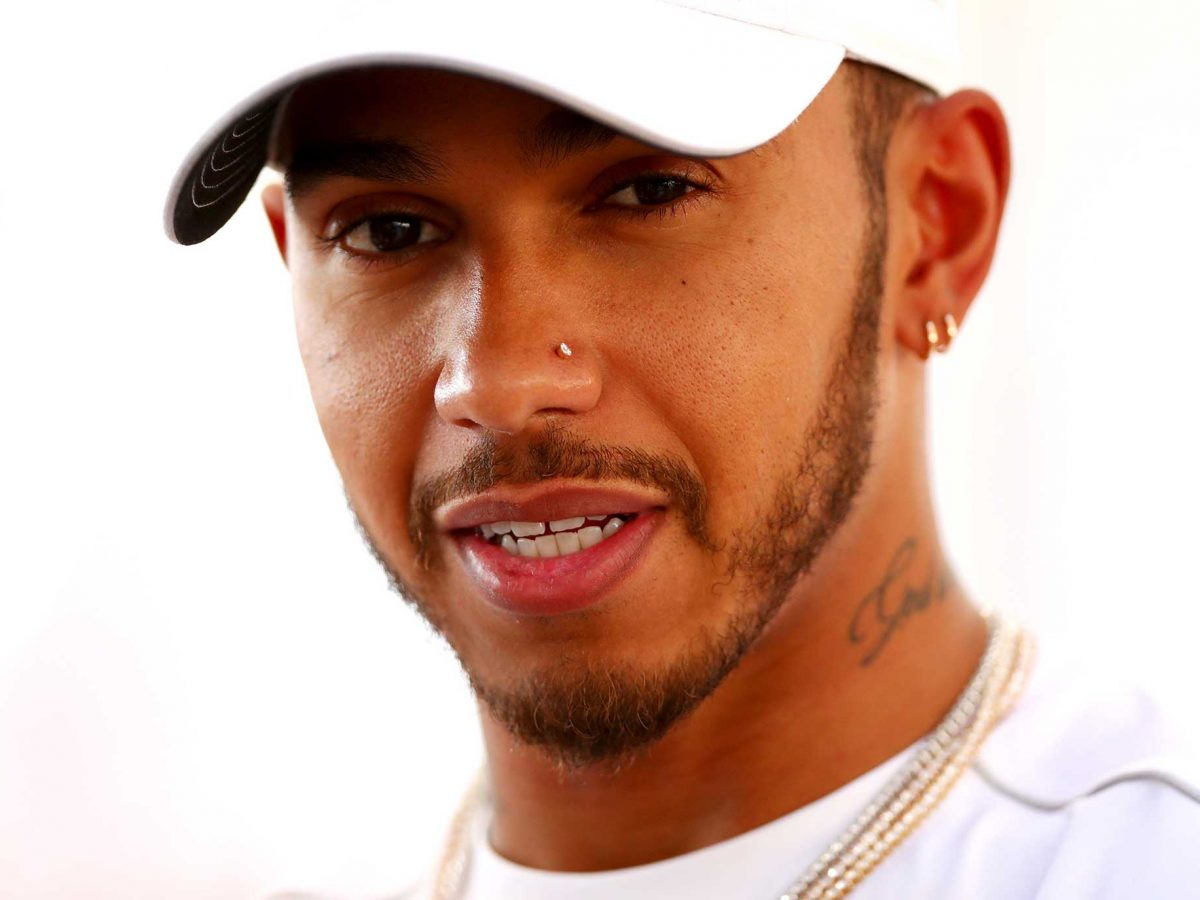 Lewis Hamilton of Great Britain and Mercedes GP looks on in the Paddock during previews for the Abu Dhabi Formula One Grand Prix at Yas Marina Circuit in Abu Dhabi.