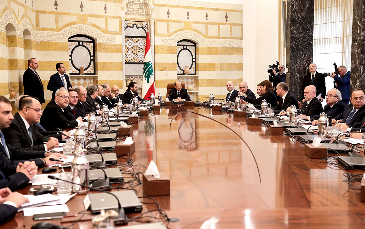 Lebanese President Michel Aoun (C) chairs the new government's first cabinet meeting, accompanied by Prime Minister Saad Hariri (C-L), at the presidential palace in Baabda, east of the capital Beirut on February 2, 2019.