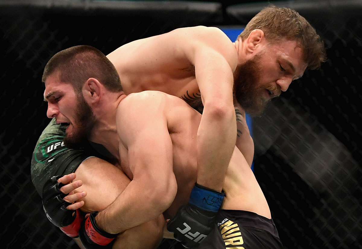 Conor McGregor of Ireland grapples with Khabib Nurmagomedov of Russia in their UFC lightweight championship bout during the UFC 229 event inside T-Mobile Arena on October 6, 2018 in Las Vegas, Nevada.