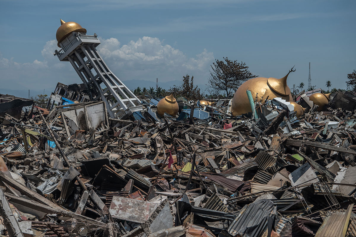 Rubble and debris lie around the ruins of a mosque following an earthquake, on October 2 in Palu, Indonesia. (Photo by Carl Court/Getty Images)