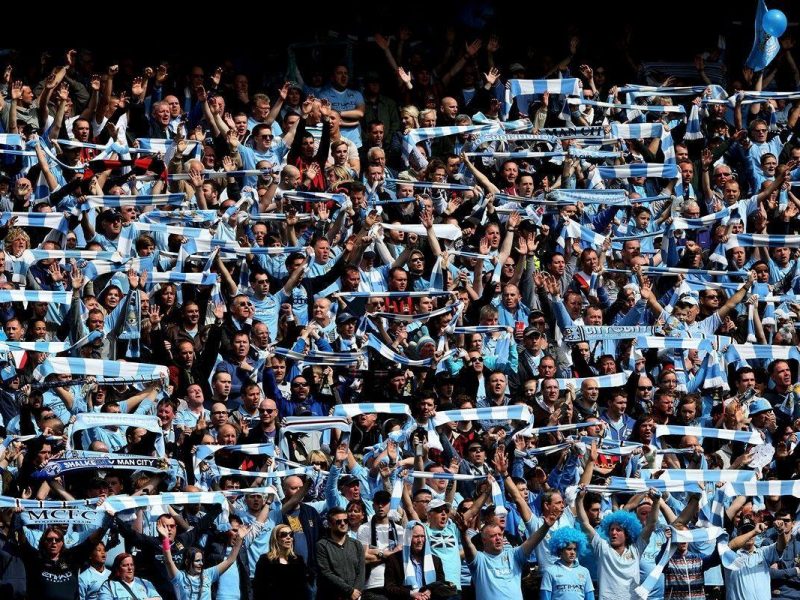 Manchester City fans celebrating winning their first league title in 44 years at the Etihad Stadium. (Getty Images)