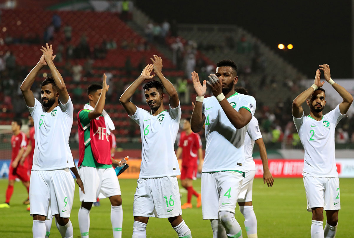 Saudi Arabia's players celebrate after winning during the 2019 AFC Asian Cup group E football match between Saudi Arabia and North Korea at the Maktoum Bin Rashid Al-Maktoum Stadium in Dubai on January 8, 2019.