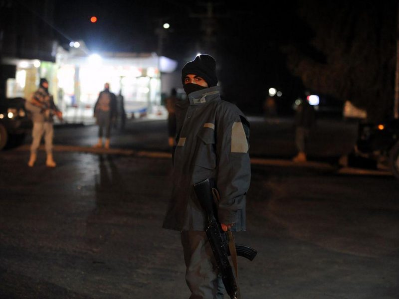 Afghan policemen standing guard at the site of an explosion near the governors compound in Kandahar. (JAWED TANVEER/AFP/Getty Images)