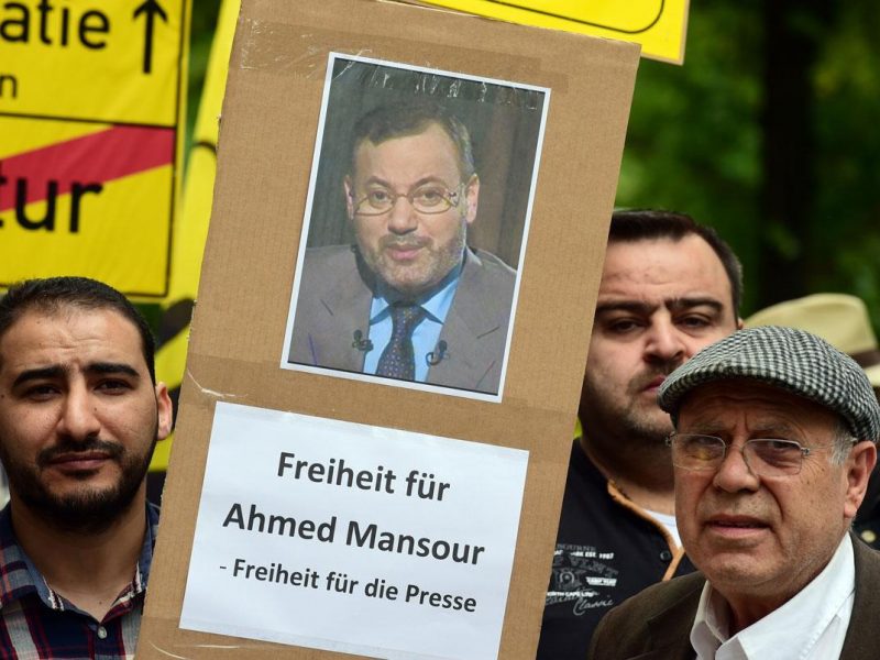 Supporters of ousted Egyptian Islamist president Mohamed Morsi stage a demonstration to ask for the release of detained Al-Jazeera journalist Ahmed Mansour in front of the local court of Berlins Tiergarten district, where Mansour is being held in custody, awaiting a judges decision on his further detention, on June 21, 2015. (AFP/Getty Ima