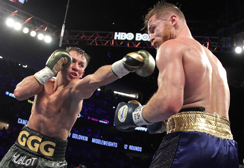 Gennady Golovkin (left) extends a left against Canelo Alvarez R during their WBC WBA and IBF middleweight championship fight at the TMobile Arena in Las Vegas.  
Photo: JOHN GURZINSKI/AFP/Getty Images