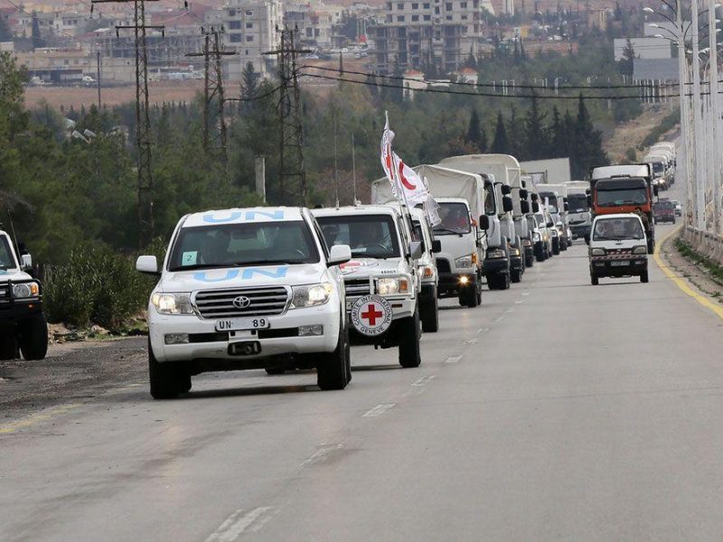 Syrian Red Crescent aid convoys carrying food, medicine and blankets, leave the capital Damascus as they head to the besieged town of Madaya on January 11, 2015. Aid convoys prepared to enter the besieged Syrian town of Madaya, which is blockaded by the Syrian regime, where more than two dozen people have reportedly starved to death accord