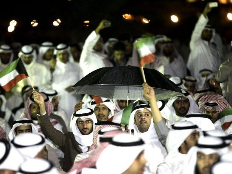 Kuwaitis gather outside the parliament in Kuwait City on November 21, 2011, during a protest calling for the resignation of the government over a graft scandal involving MPs as the opposition mounted a fierce campaign to oust the prime minister. (AFP/Getty Images)