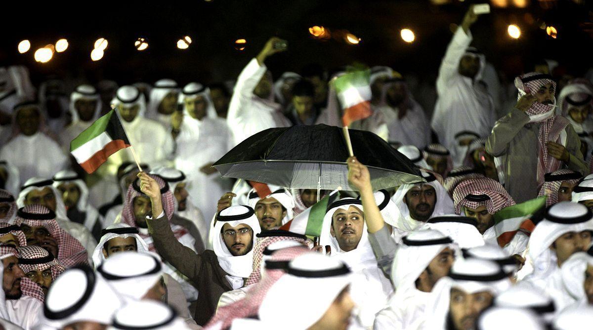 Kuwaitis gather outside the parliament in Kuwait City on November 21, 2011, during a protest calling for the resignation of the government over a graft scandal involving MPs as the opposition mounted a fierce campaign to oust the prime minister. (AFP/Getty Images)