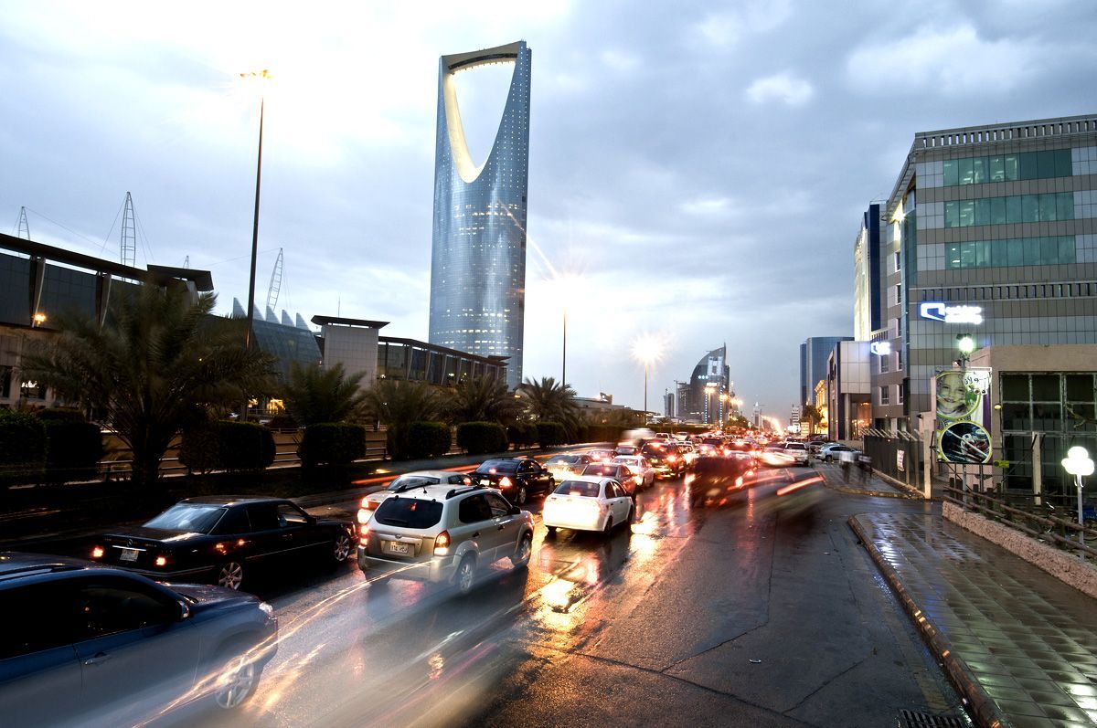 Traffic passes the Kingdom Tower left on King Fahad Road in Riyadh Saudi Arabia on Monday April 9 2012 Saudi Arabias gross domestic product expanded 664 percent in the fourth quarter from a year ago the kingdoms statistics agency said Photographer Waseem ObaidiBloomberg