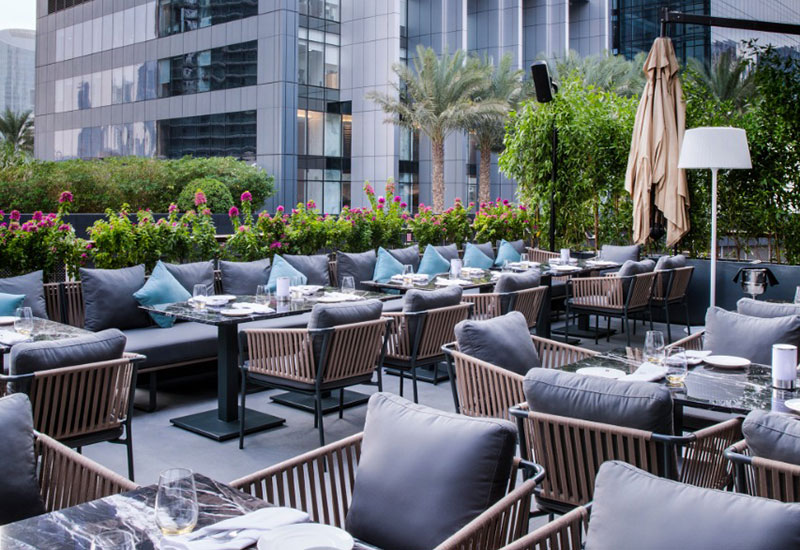 Roberto's outdoor terrace overlooks the dazzling Burj Khalifa