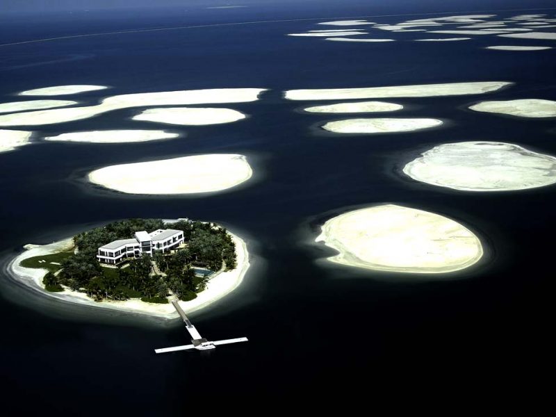 An aerial view shows a cluster of man-made islands known as The World, by Emirati property developers Nakheel, off the coast of Dubai on December 21, 2009. The German real estate company Kleindienst has announced plans to build luxury villas and hotels on six of the artificial islands despite the huge financial woes faced by the Gulf emira