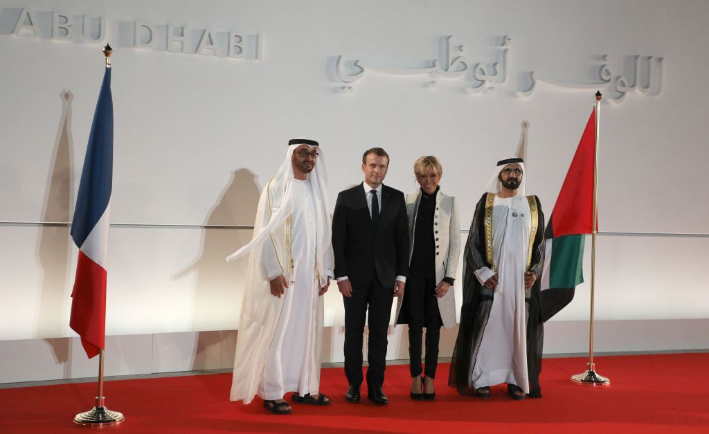 From L to R: Abu Dhabi Crown Prince Mohammed bin Zayed Al Nahyan, French President Emmanuel Macron his wife Brigitte Macron and Ruler of Dubai Sheikh Mohammed bin Rashid al Maktoum pose at the entrance of the Louvre Abu Dhabi Museum during its inauguration on Saadiyat island in the Emirati capital  
Photo: LUDOVIC MARIN/AFP/Getty Images.