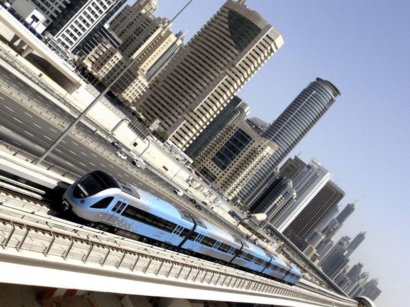 A Dubai Metro train speeds past Sheikh Zayed road in Dubai on September 8, 2010. Dubai Metro may have altered the commuting scene in this car-loving city, but a year after the first train left the station winning over the hard-core motorists remains an uphill struggle. (AFP/Getty Images)