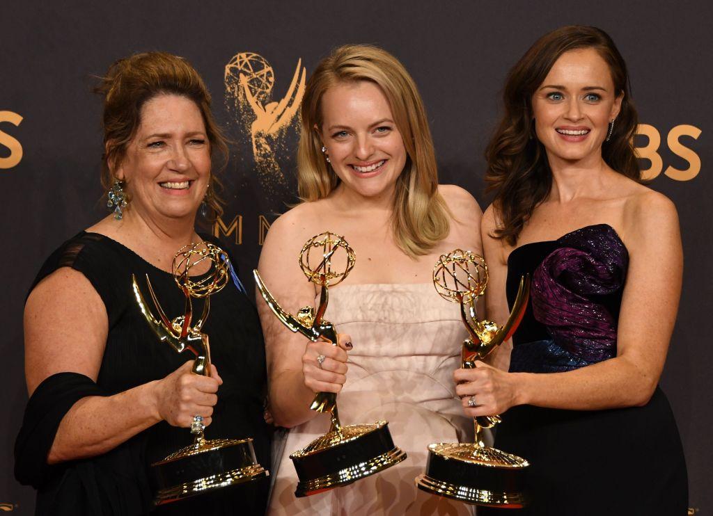 Ann Dowd, Elisabeth Moss and Alexis Bledel pose with the award for  Outstanding Drama Series for The Handmaids Tale during the 69th Emmy Awards at the Microsoft Theatre in Los Angeles California. Photo: MARK RALSTON/AFP/Getty Images.