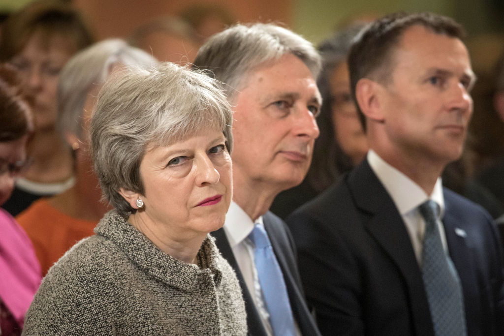 Britain's Chancellor of the Exchequer Philip Hammond (centre), Health Secretary Jeremy Hunt (right) and Britain's Prime Minister Theresa May (left). 
Photo: STEFAN ROUSSEAU/AFP/Getty Images